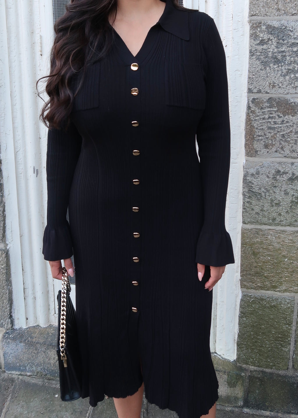 Black sweater dress, gold buttons, cuff sleeves, midi length, v-neck, collar