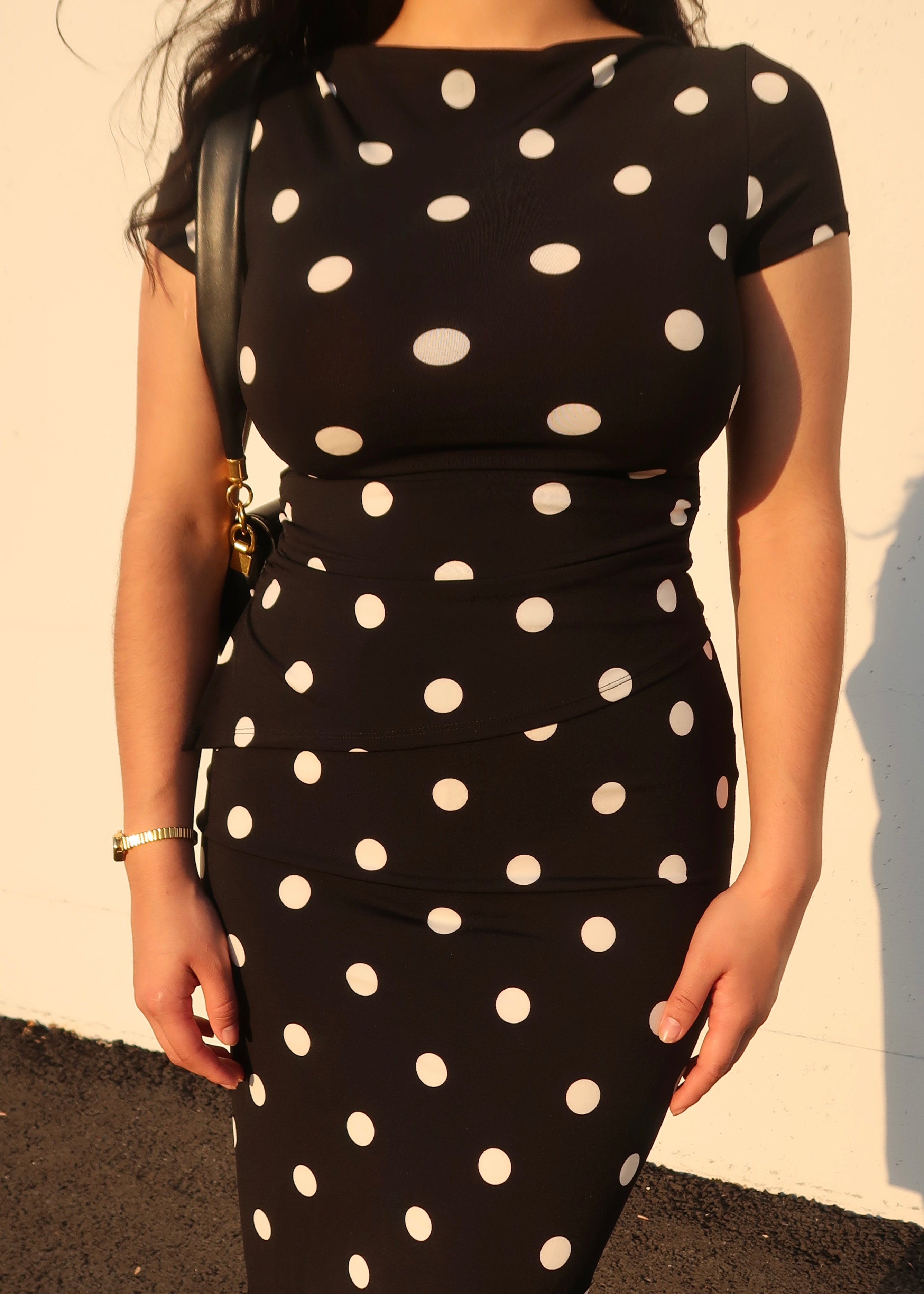 black polka dot asymmetrical cap sleeve top