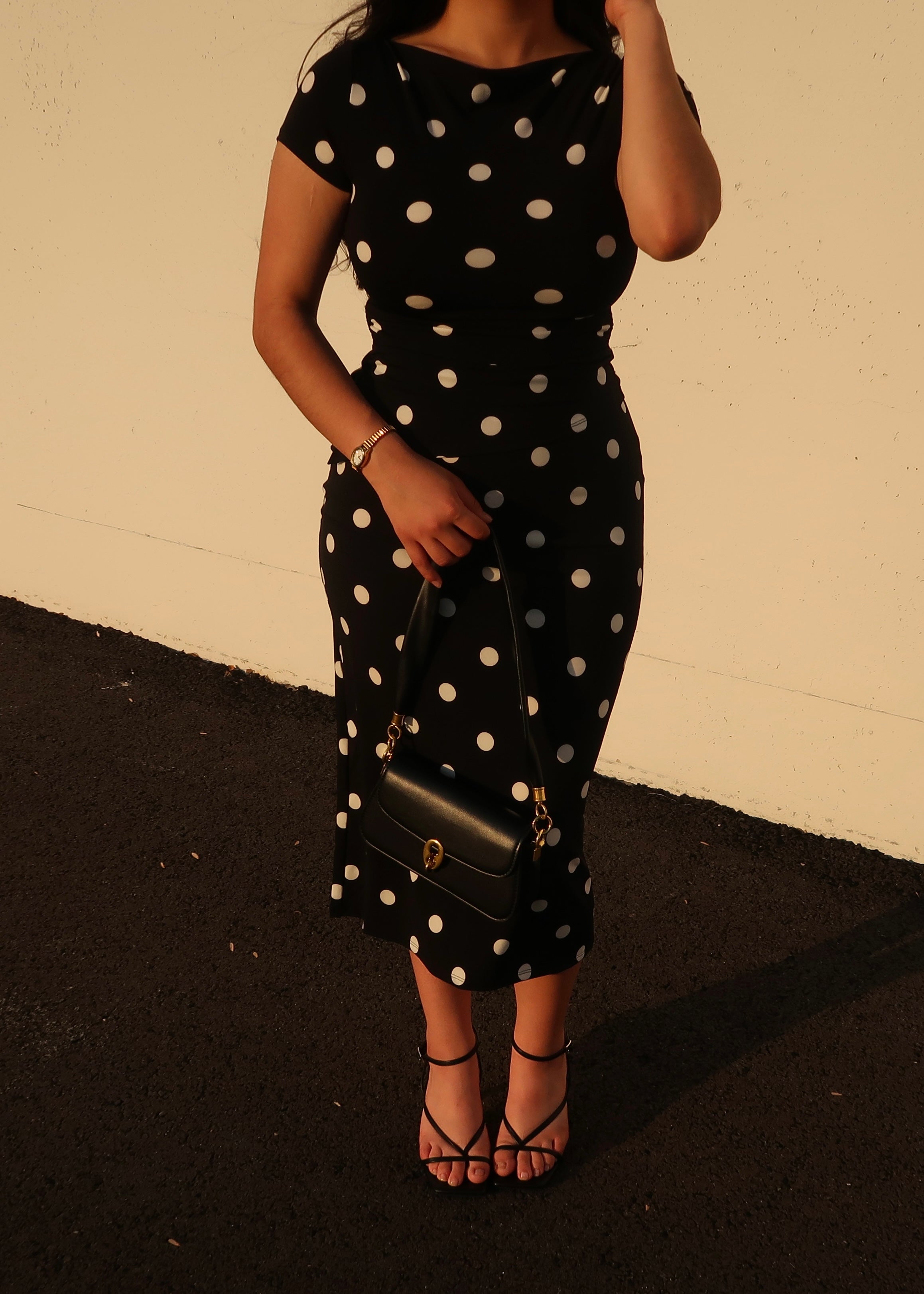 black polka dot asymmetrical cap sleeve top