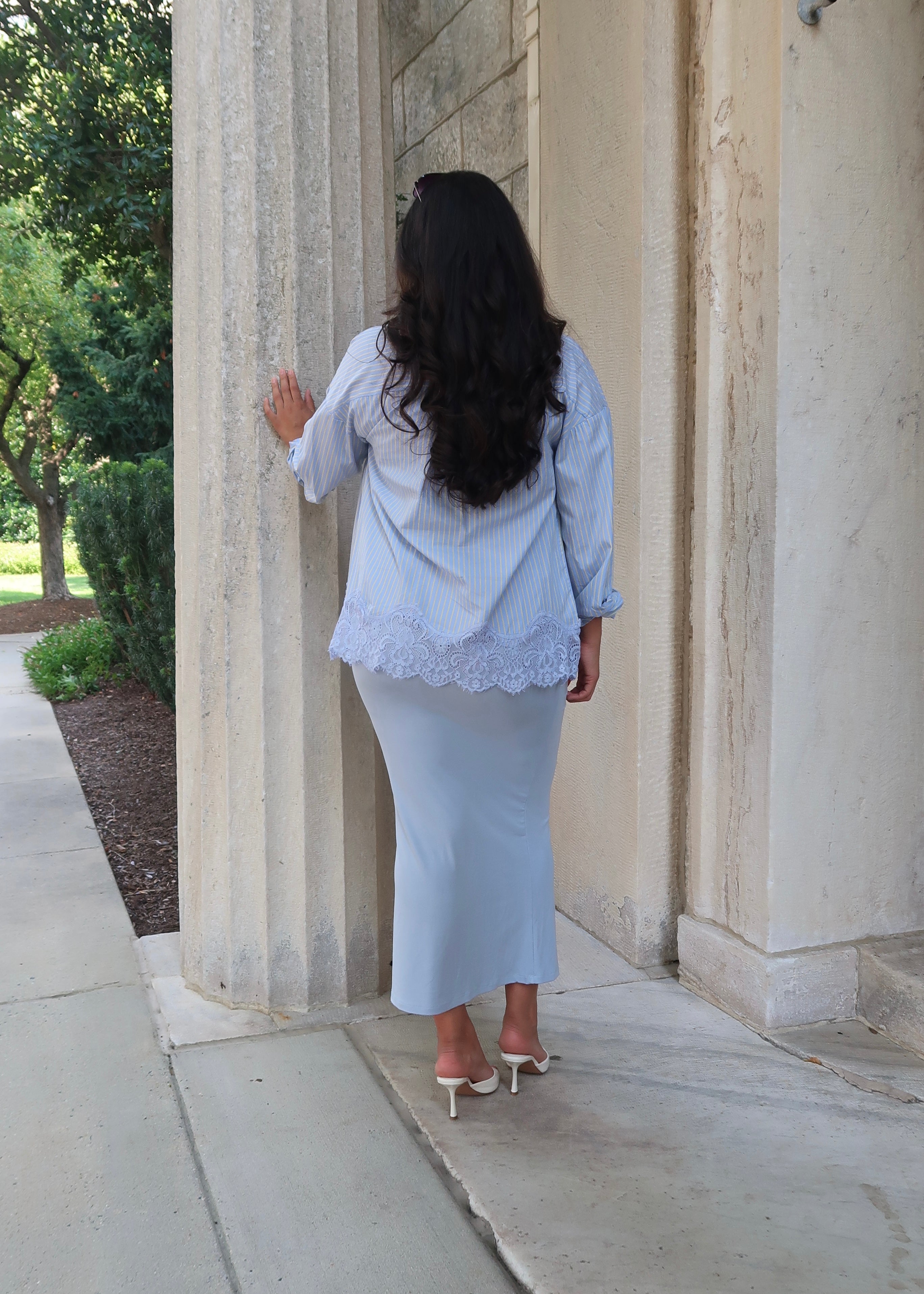 Blue and yellow pinstripe womens button down blouse, collared, lace hem, long sleeves, baby blue dress underneath, white heels 