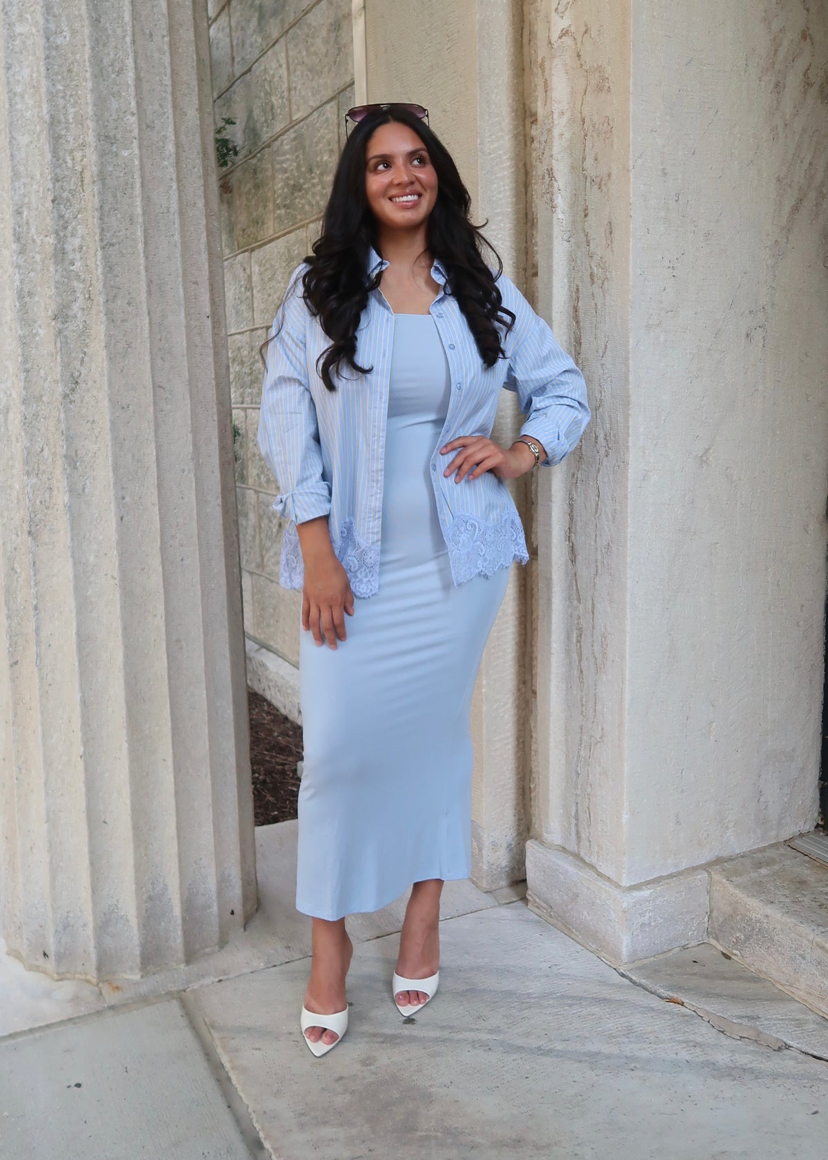 Blue and yellow pinstripe womens button down blouse, collared, lace hem, long sleeves, baby blue dress underneath, white heels 