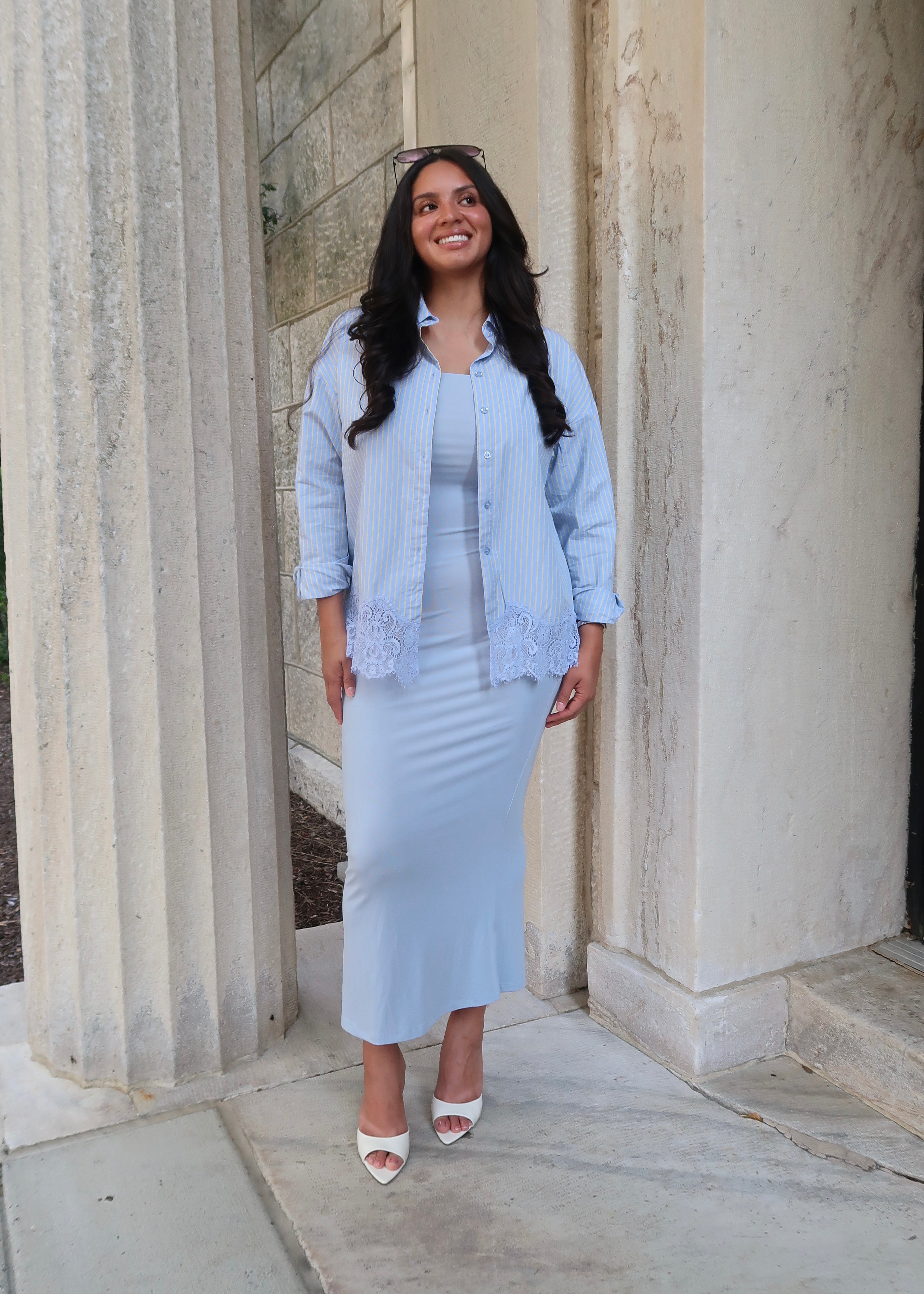 Blue and yellow pinstripe womens button down blouse, collared, lace hem, long sleeves, baby blue dress underneath, white heels 
