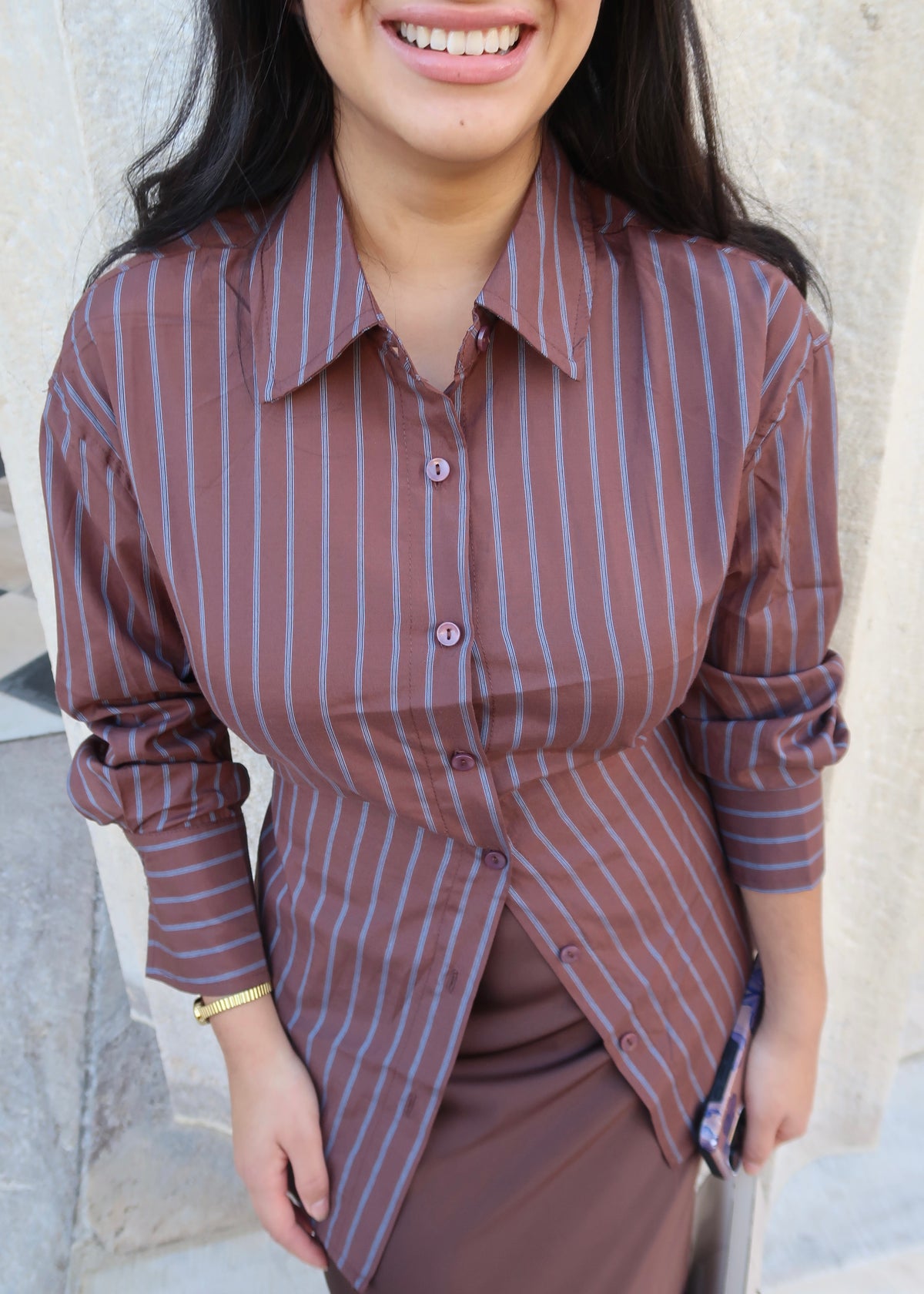 brown and blue striped button down, collared blouse, long sleeve, tie back