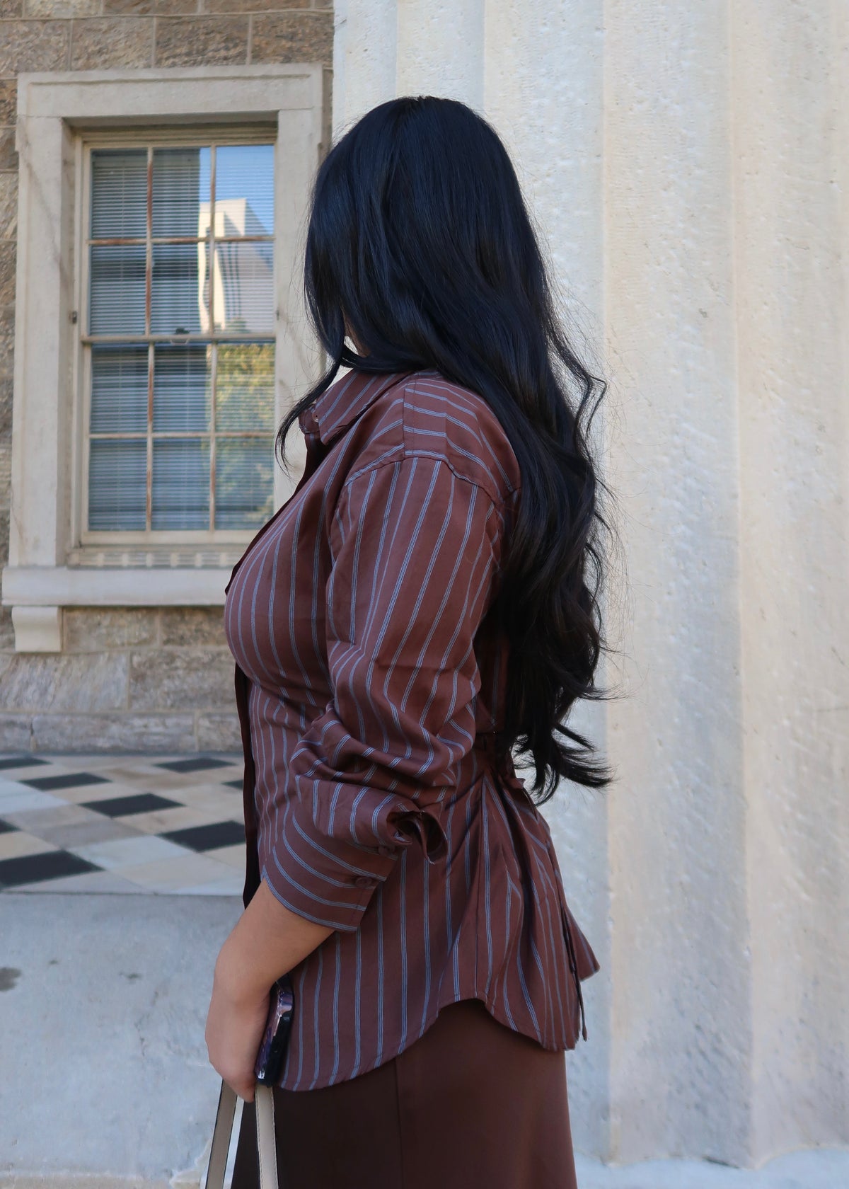 brown and blue striped button down, collared blouse, long sleeve, tie back