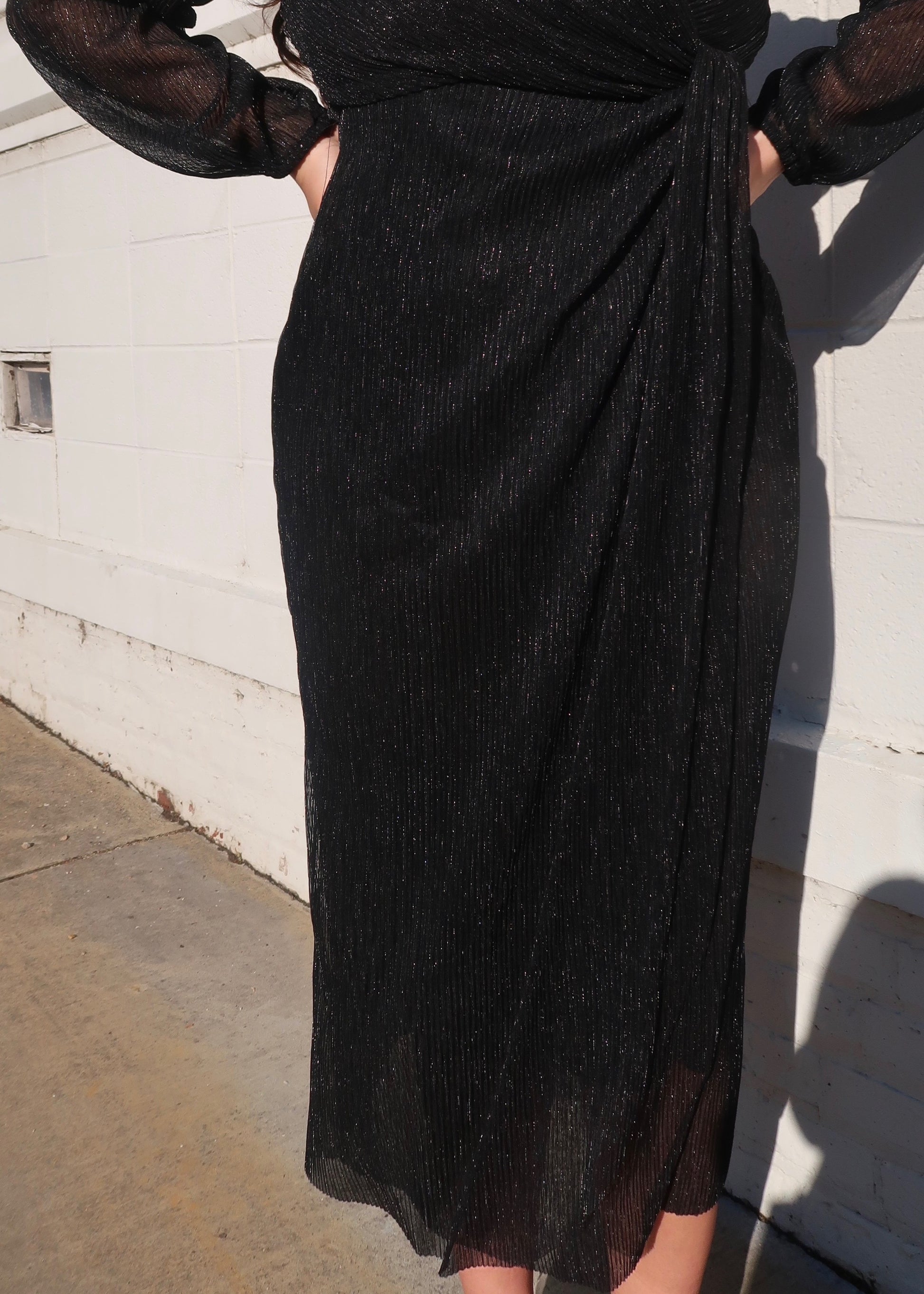 black glittered sparkly sheer sleeve long sleeve dress v neck drap midi length