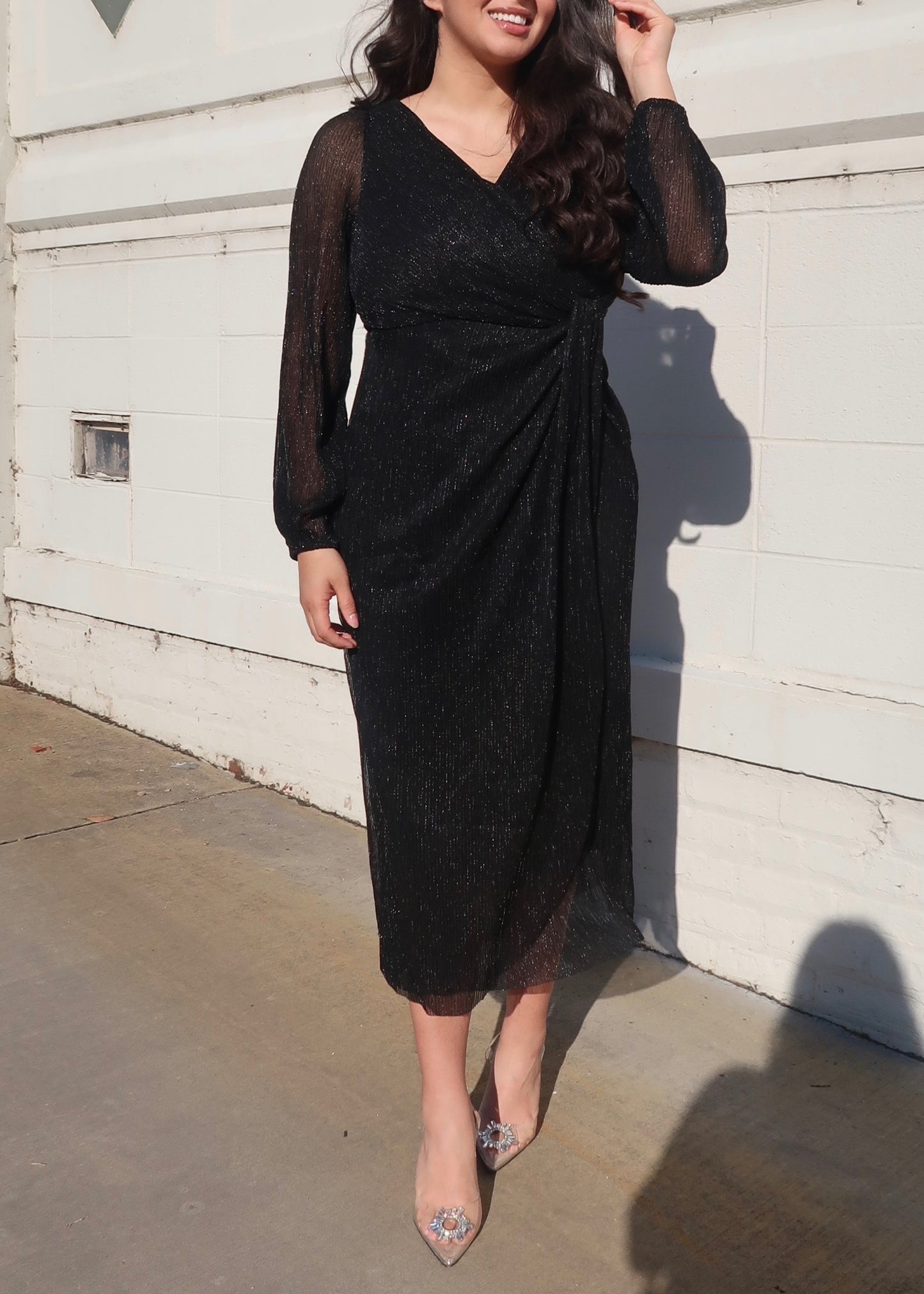 black glittered sparkly sheer sleeve long sleeve dress v neck drap midi length