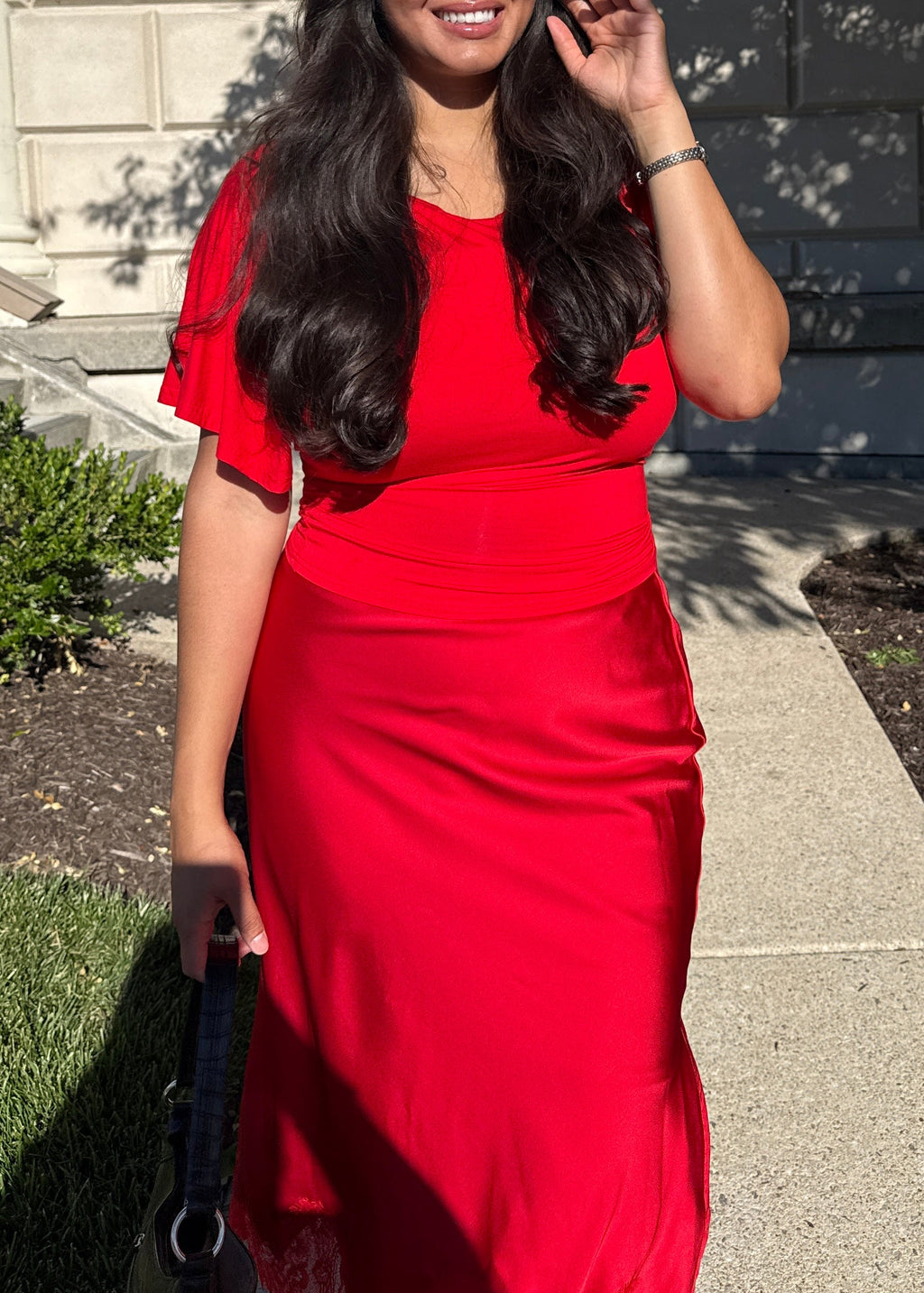 red outfit, red draped short sleeve top, waist tie, red skirt 