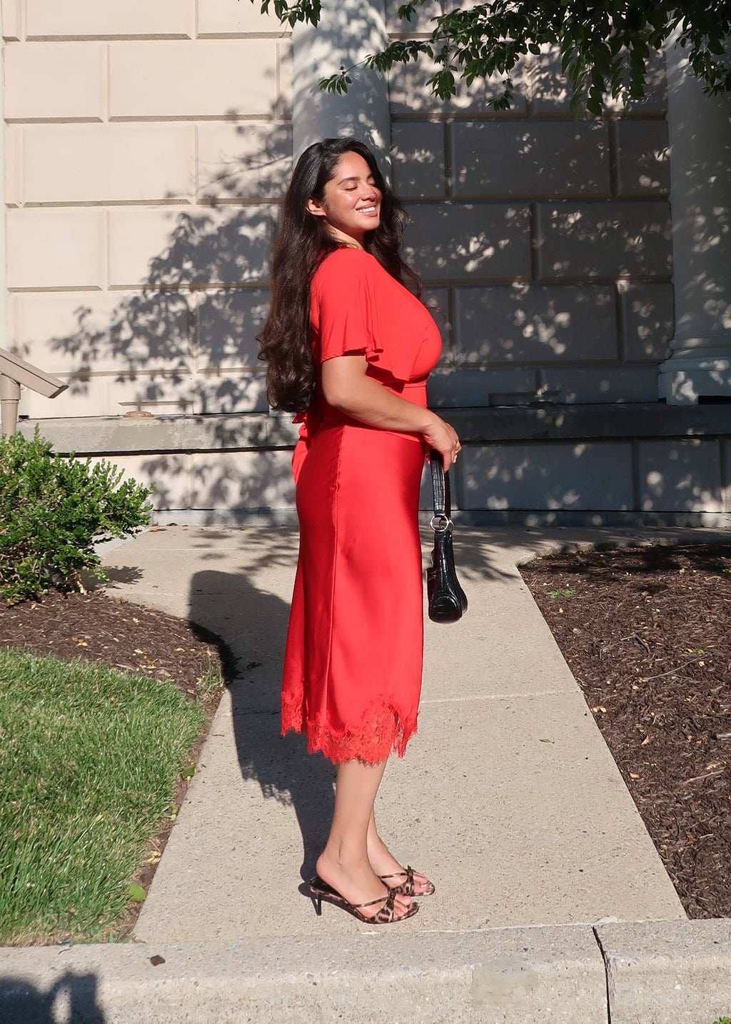red outfit, red draped short sleeve top, waist tie, red skirt 