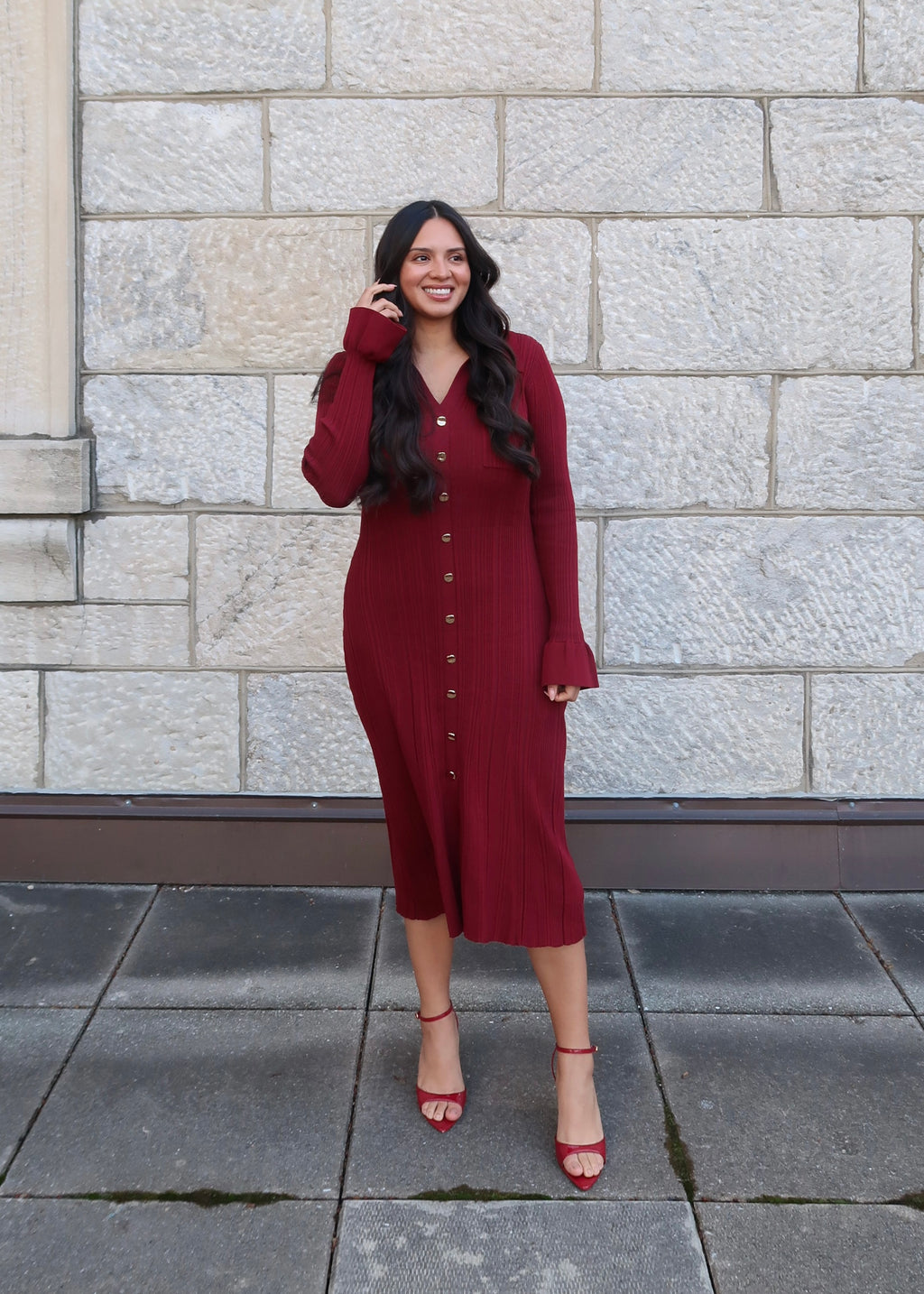 Wine red sweater dress, v-neck, collared, cuff, midi length, gold buttons, red heels