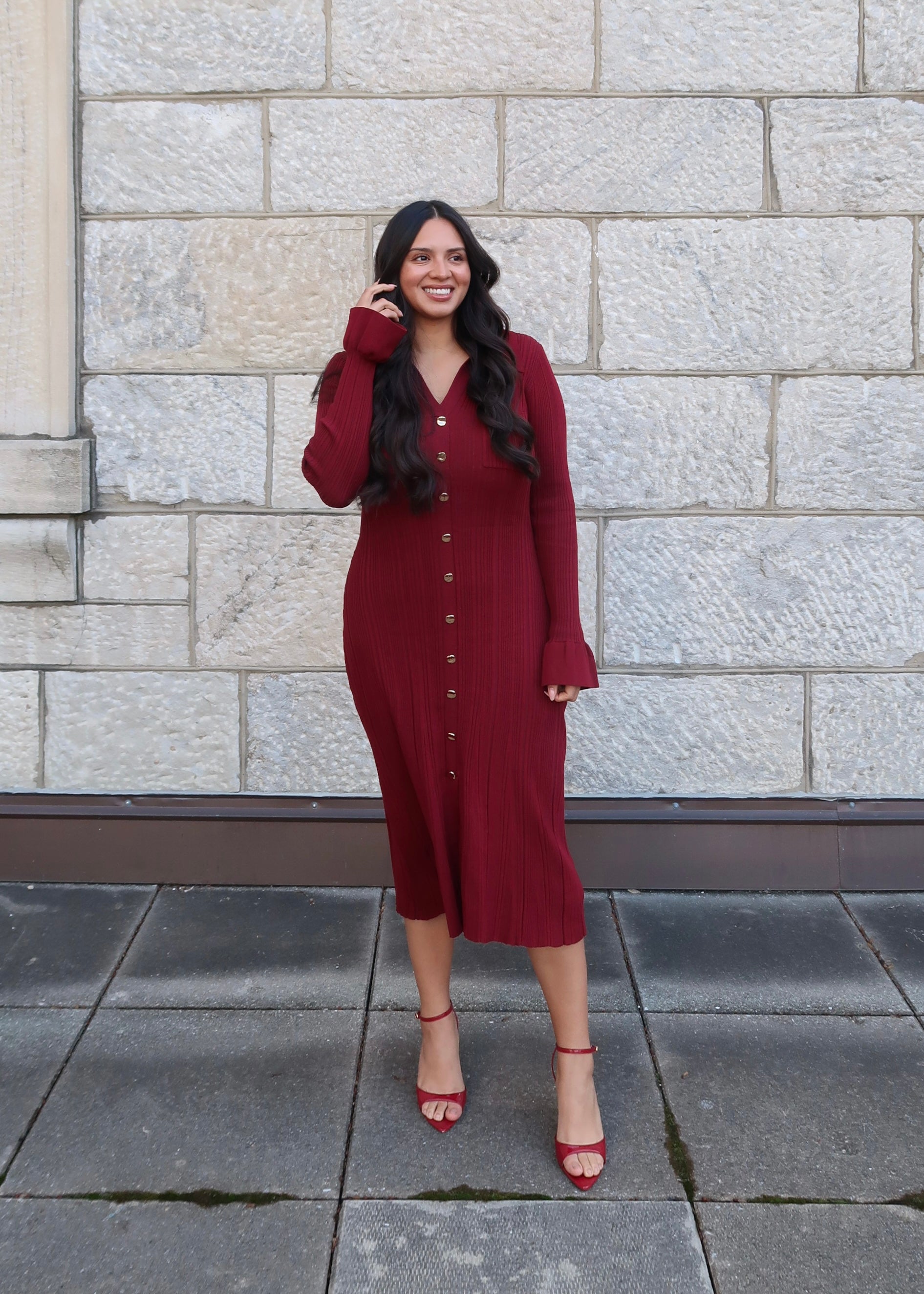 Wine red sweater dress, v-neck, collared, cuff, midi length, gold buttons, red heels