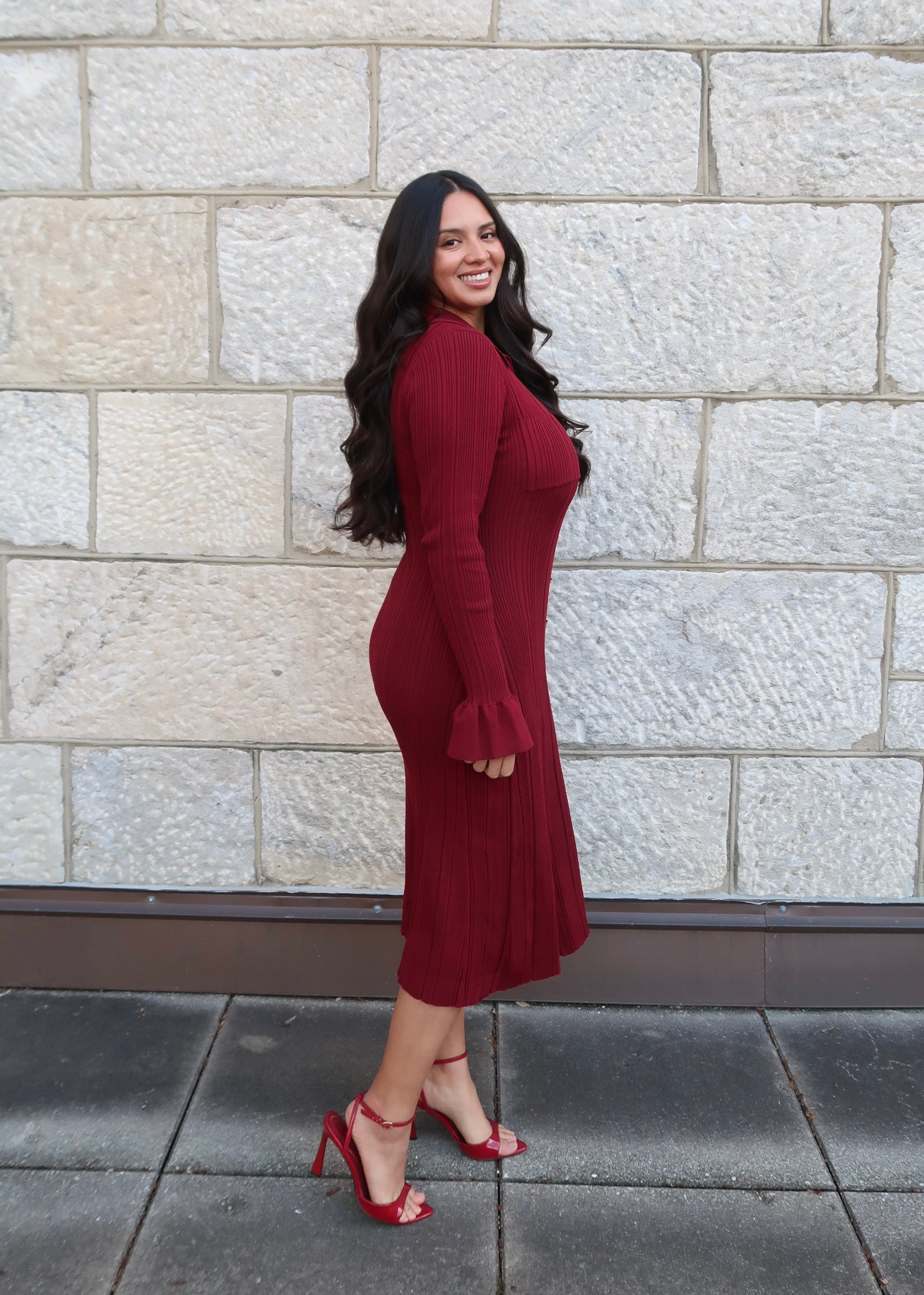 Wine red sweater dress, v-neck, collared, cuff, midi length, gold buttons, red heels