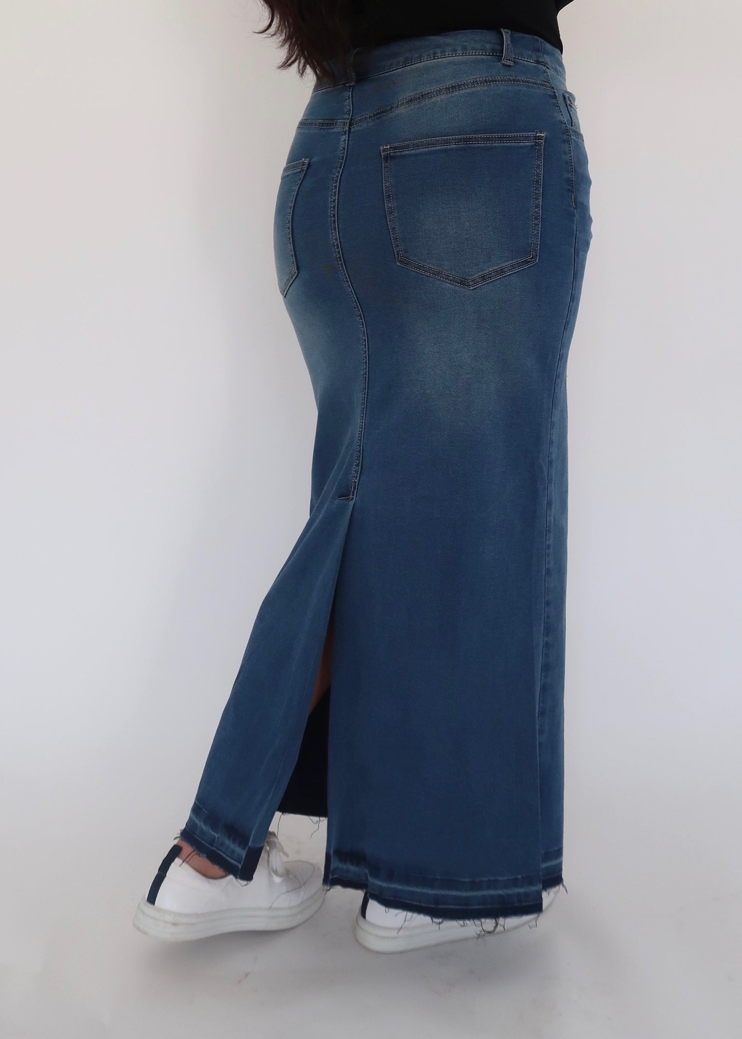 medium wash denim maxi skirt slit raw hem